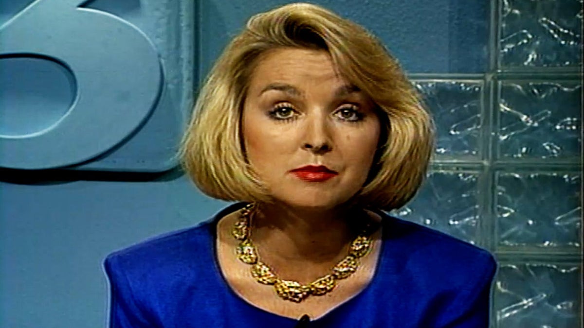 Jodi Huisentruit wearing a blue dress speaking on television.