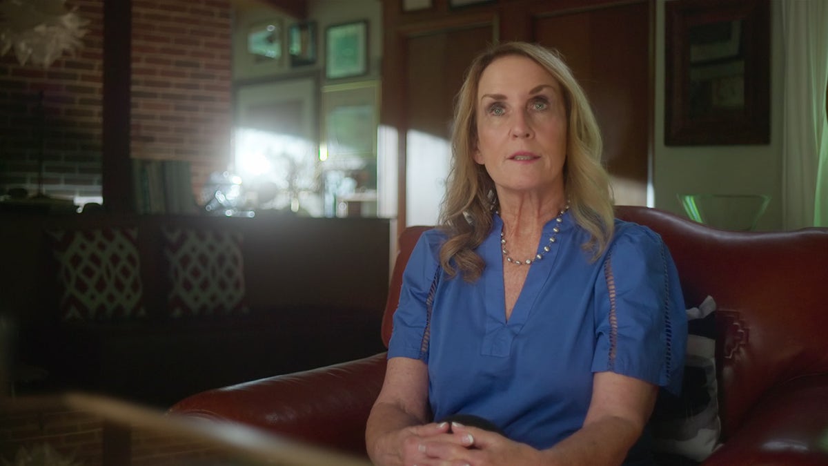 Judy Maurer wearing a blue blouse.