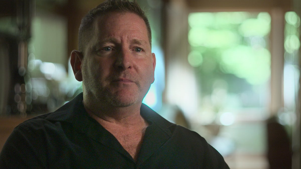 Kirk Detweiler wearing a black shirt.