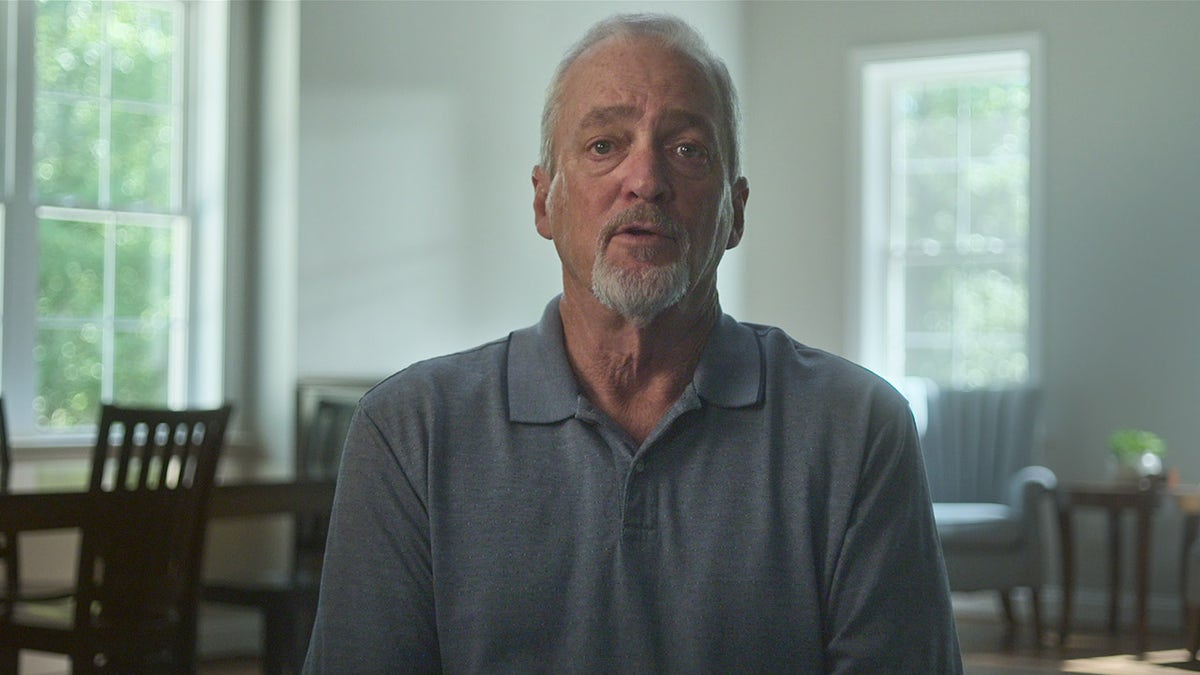 Ron Bradley wearing a grey shirt.