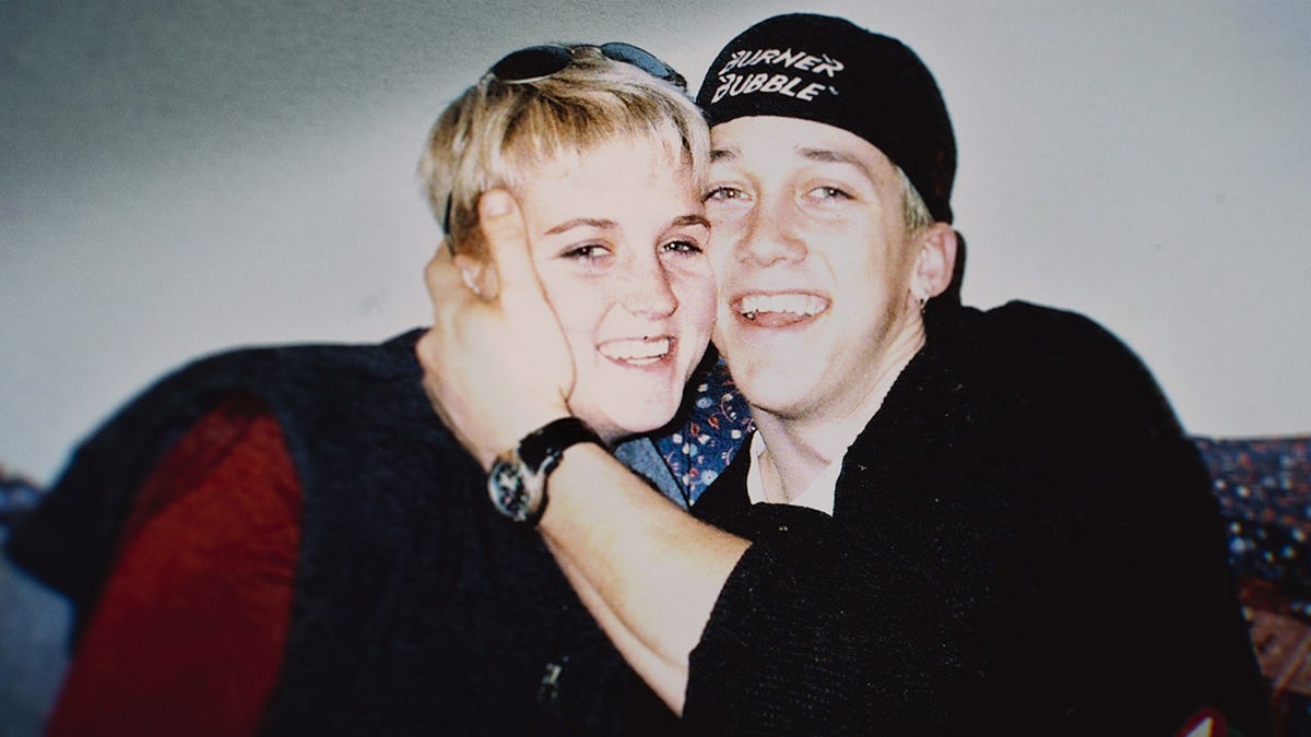 Brad Bradley embracing Amy Bradley