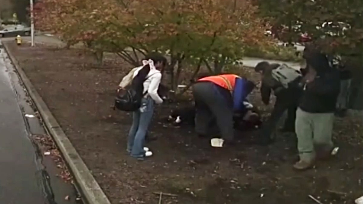 A crowd of people seen gathering around the fight and trying to help the victim