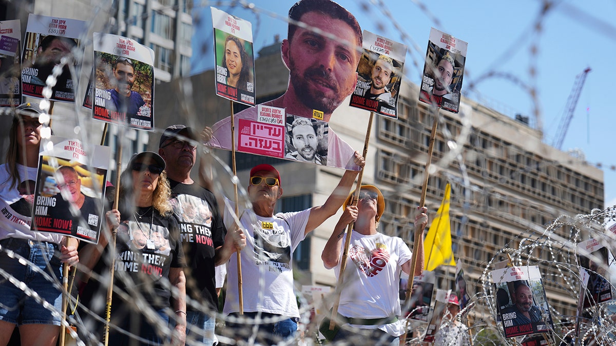 Families of hostages protest at the plaza known as the Hostages Square in Tel Aviv, Israel, Saturday, Aug. 2, 2025.