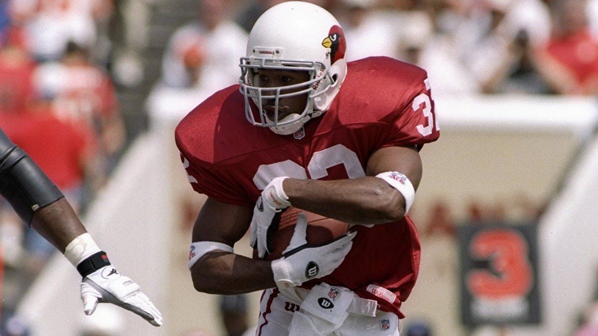 Leshon Johnson runs with football