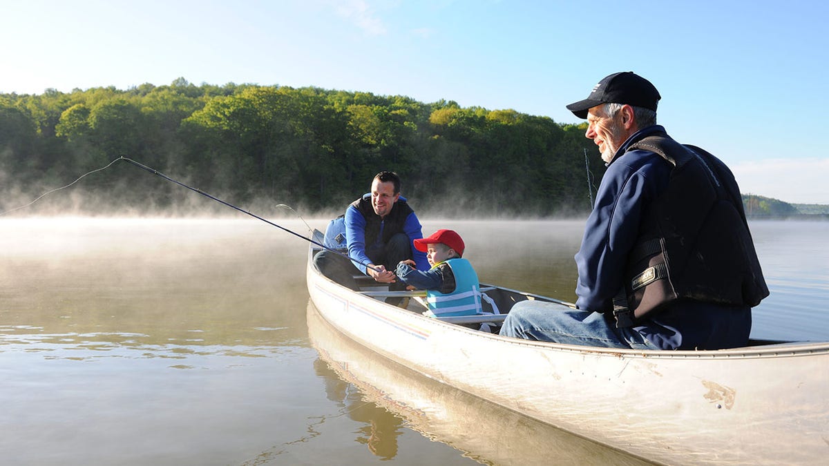 A boat with three people fishing in Atwood Lake in Ohio. 