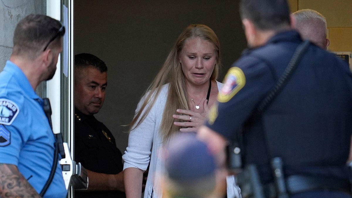People outside of a catholic school after mass shooting.