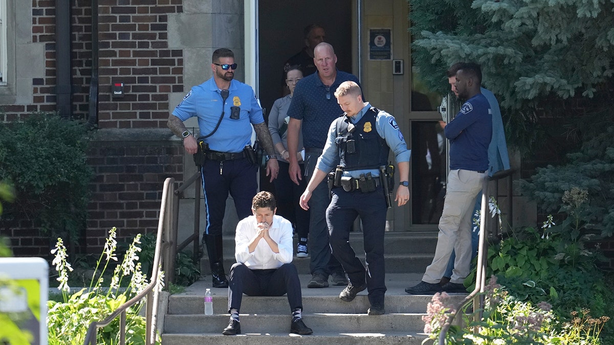 Minneapolis Mayor Jacob Frey with law enforcement at the catholic school after shooting.