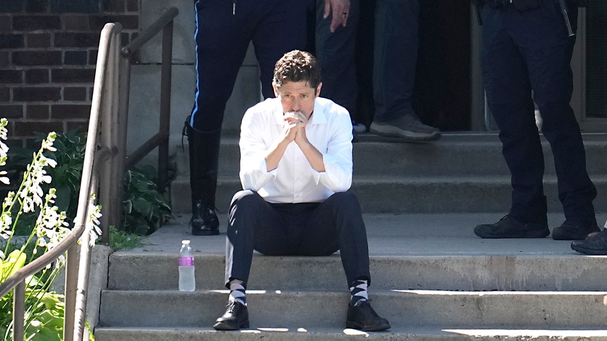 Minneapolis Mayor Jacob Frey with law enforcement at the catholic school after shooting.