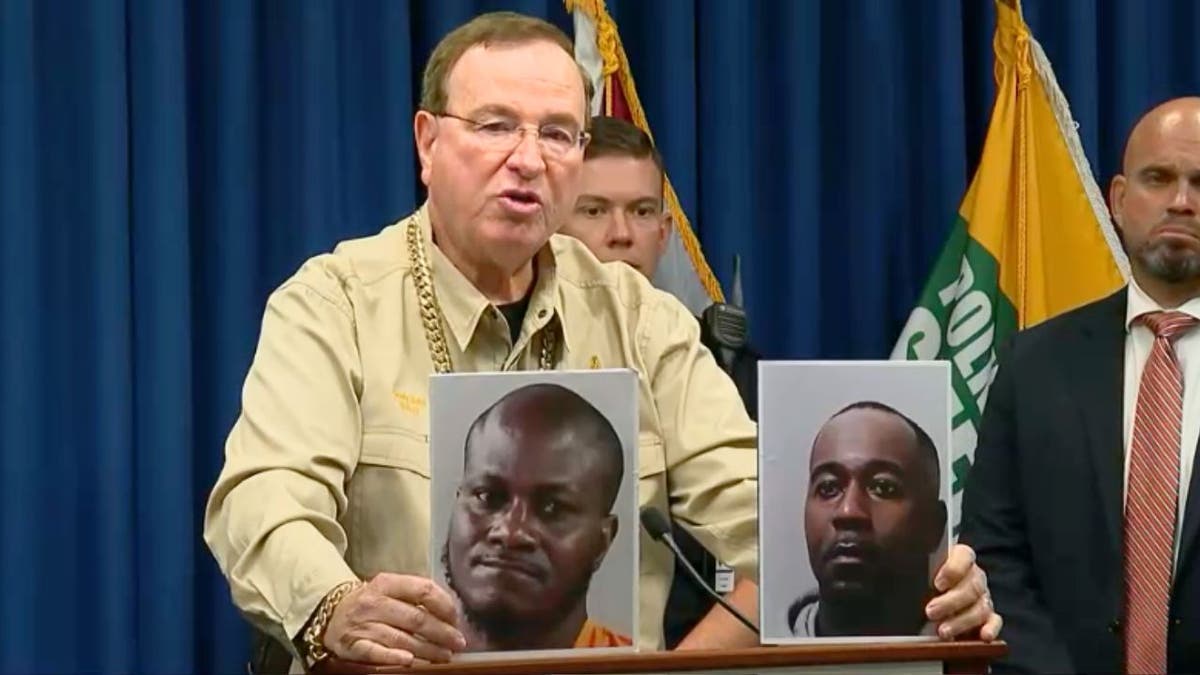 Sheriff Grady Judd displays photos of suspects arrested in Bartow drug bust.