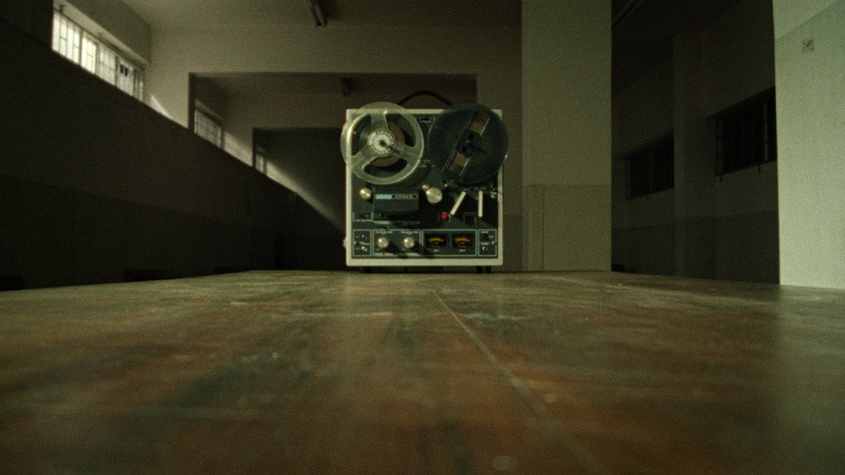 A recording machine playing a tape.