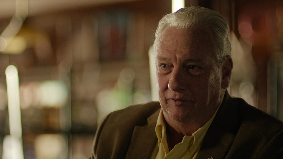 A close-up of Carl Denaro appearing emotional.