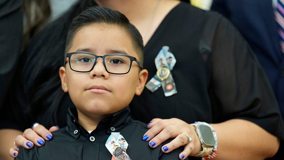 A child in the White House honoring a service member killed in Abbey Gate. 