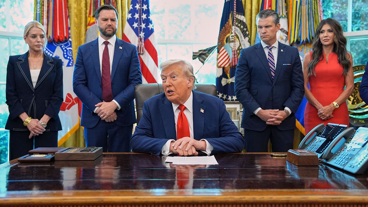 President Donald Trump sitting in Oval Office