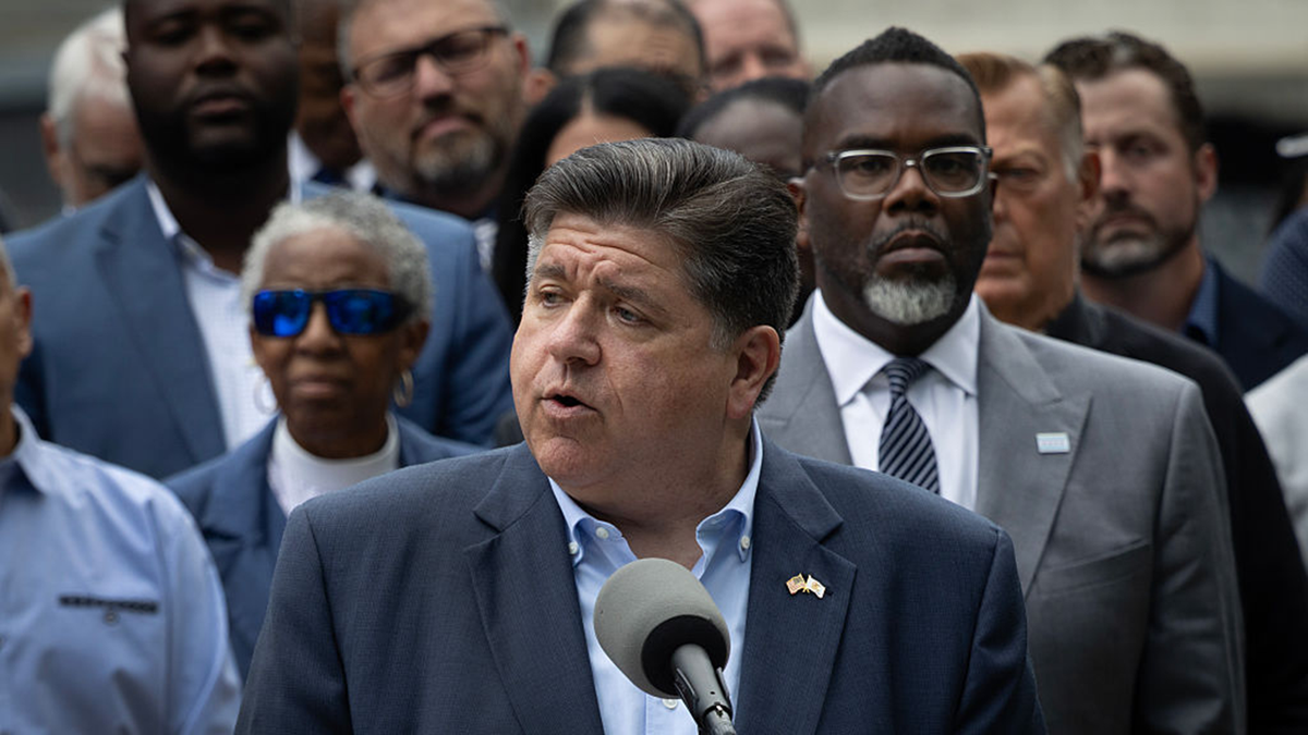 Gov. Pritzker speaks at a podium