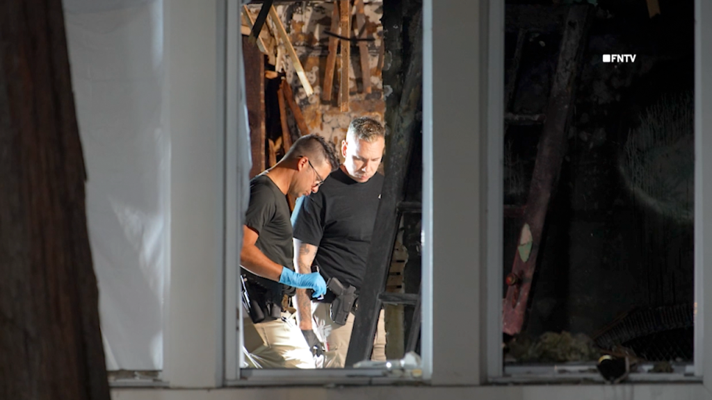 Couple found tied up and burned to death in home near famous racetrack as police hunt for suspect