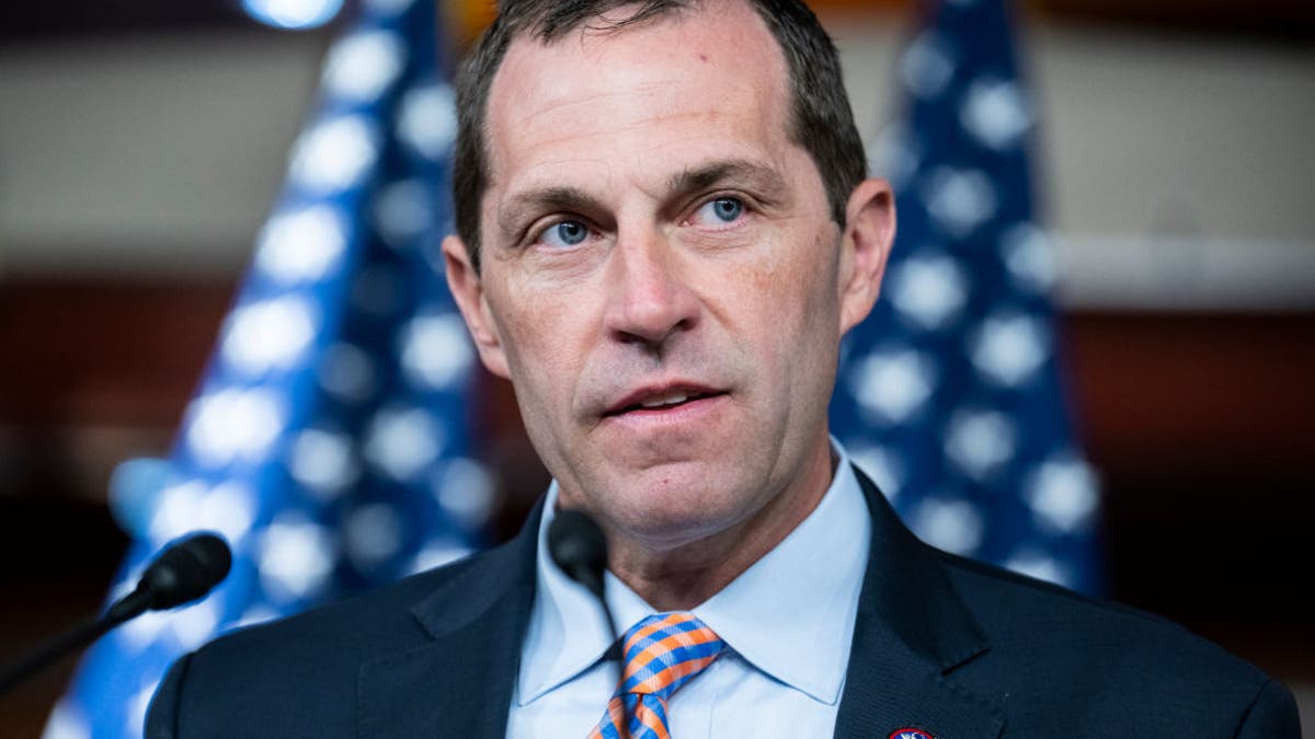 Rep. Jason Crow, D-Colo., conducts a news conference after a meeting of the House Democratic Caucus in the Capitol Visitor Center on July 13, 2022.