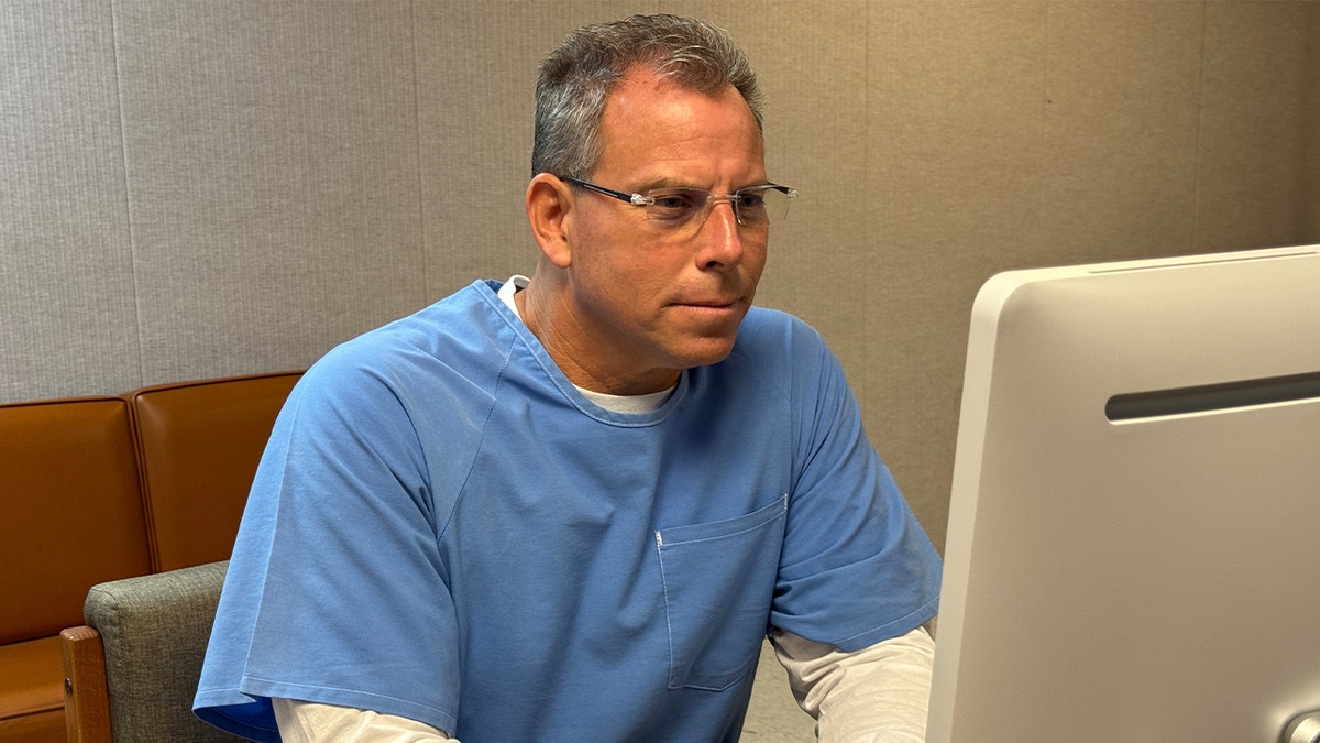 Parole hearing attended by Erik Menendez from a desktop computer