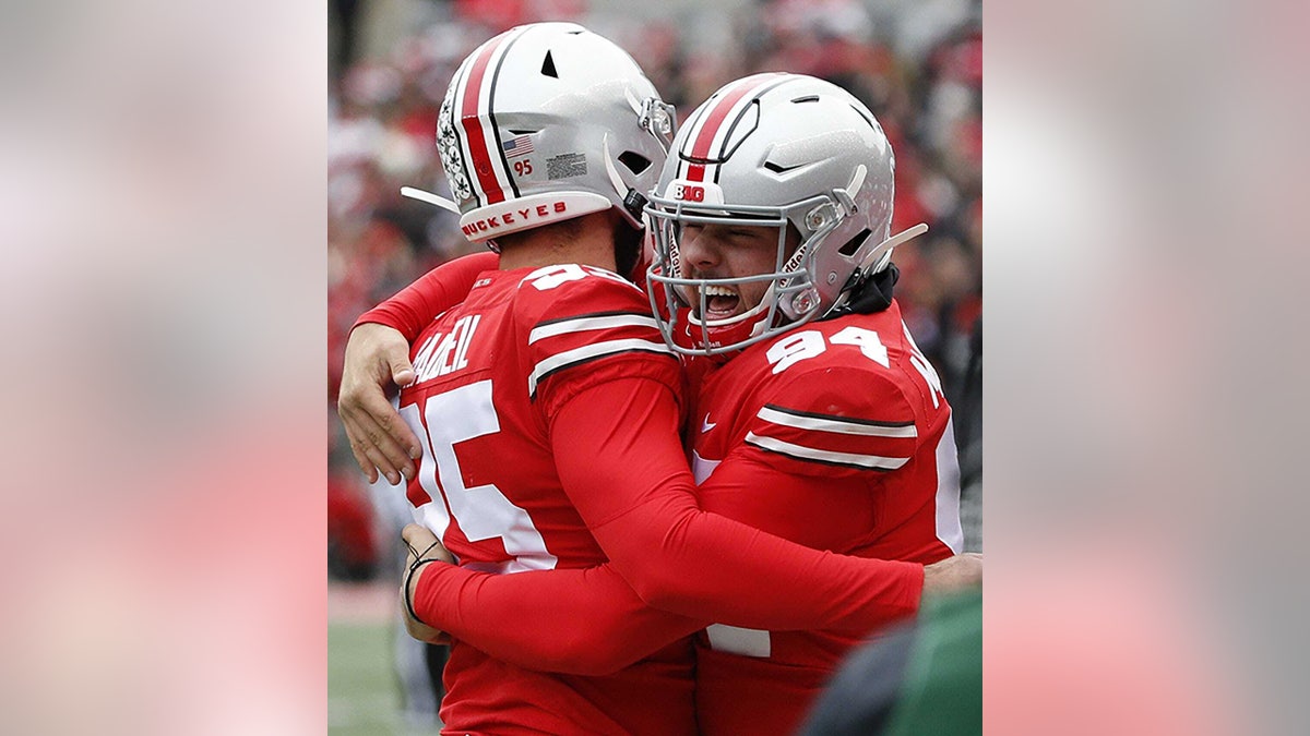 Ohio State Buckeyes long snapper Roen McCullough celebrates