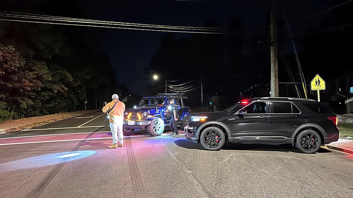 Police blocking a road to the country club