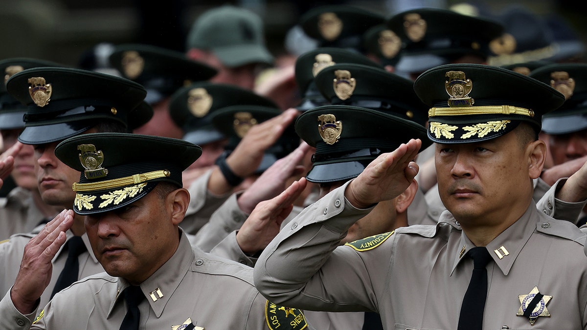 Members of the Los Angeles Sheriff's Department salute during the National Peace Officers Memorial Service at the U.S. Capitol on May 15, 2024, in Washington, DC. The Service honors law enforcement officers who have been killed in the line of service. 