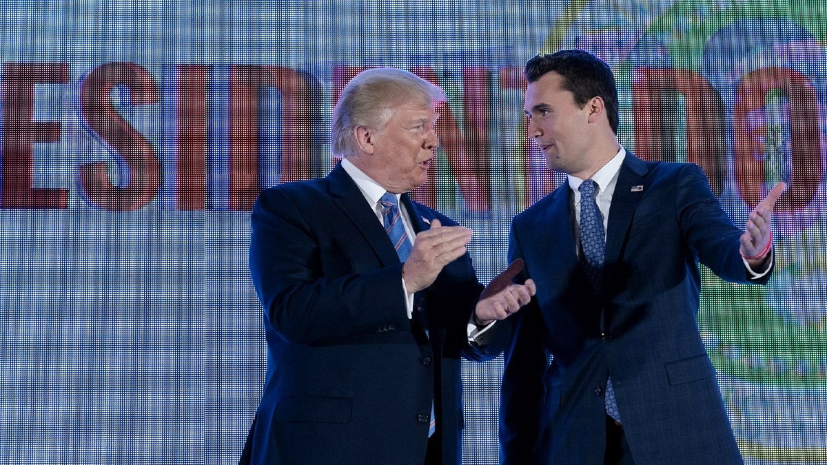 charlie kirk and donald trump during rally smiling