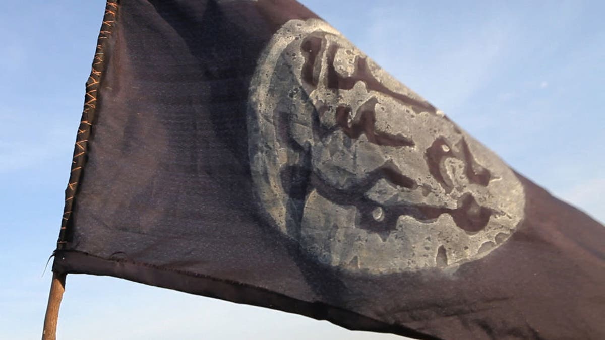 A Boko Haram flag flutters from an abandoned command post in Gamboru deserted after Chadian troops chased them from the border town on February 4, 2015.