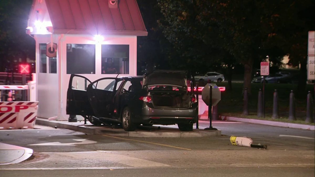 Car drives into White House barricade