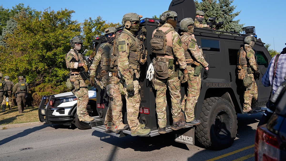 Federal law enforcement rides on vehicle in Broadview, Ill.