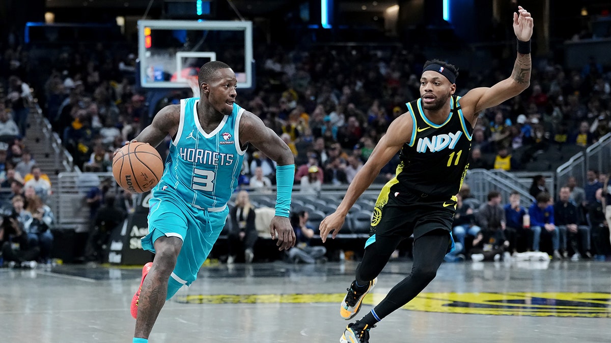 Terry Rozier dribbles the ball