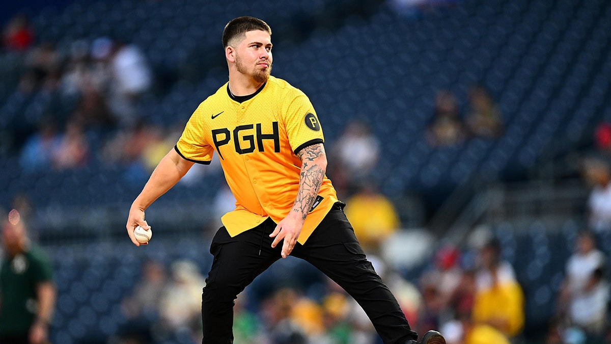 Kavan Markwood throws first pitch