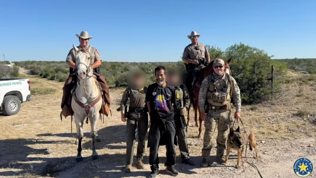 Photo of the team with Adan Delgado-Ortega after his arrest on a Texas ranch.