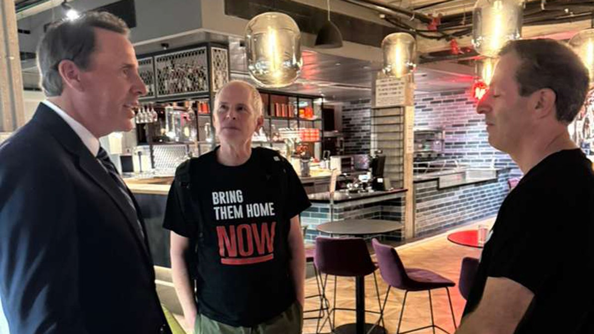 Mark Walker meets former hostage Mark Walker, and Ruby Chen.