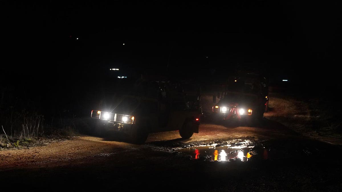 IDF armored vehicles maneuver in the Beit Jann area of southern Syria