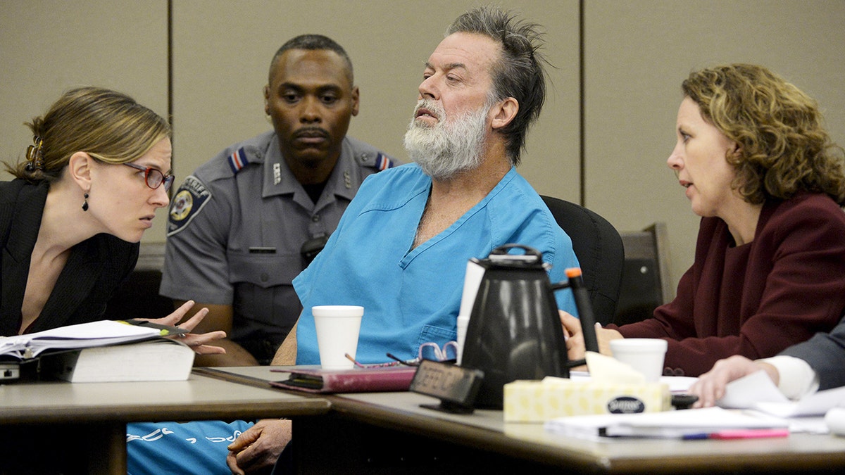 Robert Dear in courtroom, sitting in chair