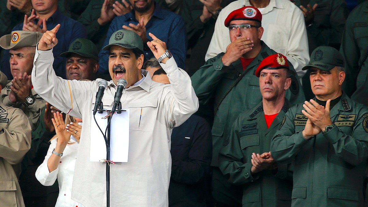 In this April 13, 2019, file photo, Nicolas Maduro, speaks flanked by Defense Minister Vladimir Padrino Lopez, right, and Gen. Ivan Hernandez, second from right, head of both the presidential guard and military counterintelligence in Caracas, Venezuela.