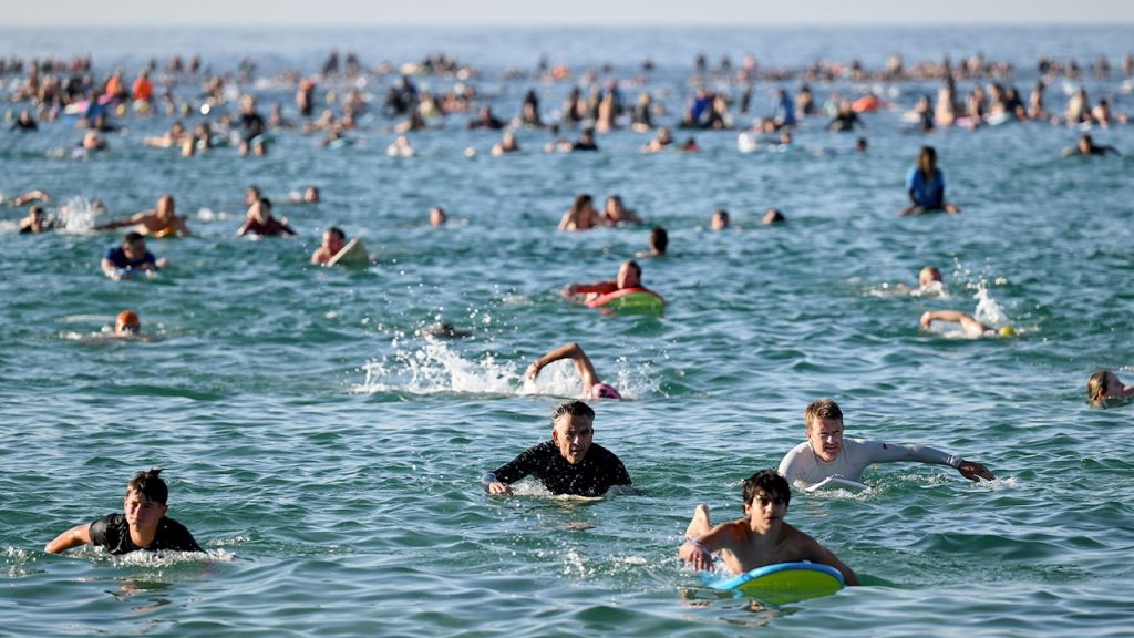 Thousands gather as Bondi Beach reopens, commemorating victims of Hanukkah attack Thousands gather as Bondi Beach reopens, commemorating victims of Hanukkah attack