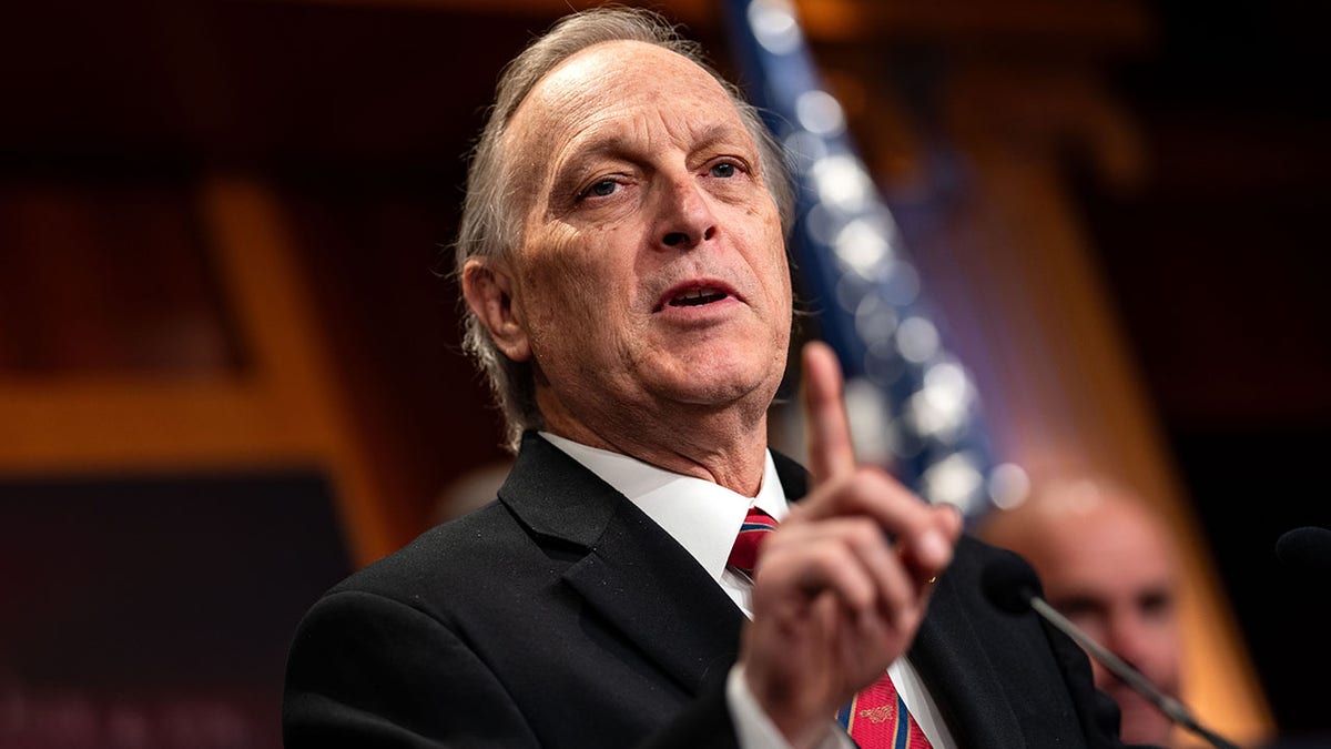 Rep. Andy Biggs speaks to reporters.