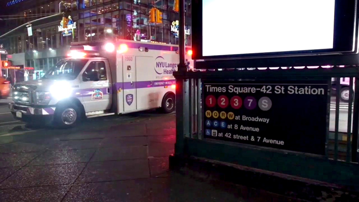 an ambulance outside the Times Square subway station where a man was allegedly set on fire
