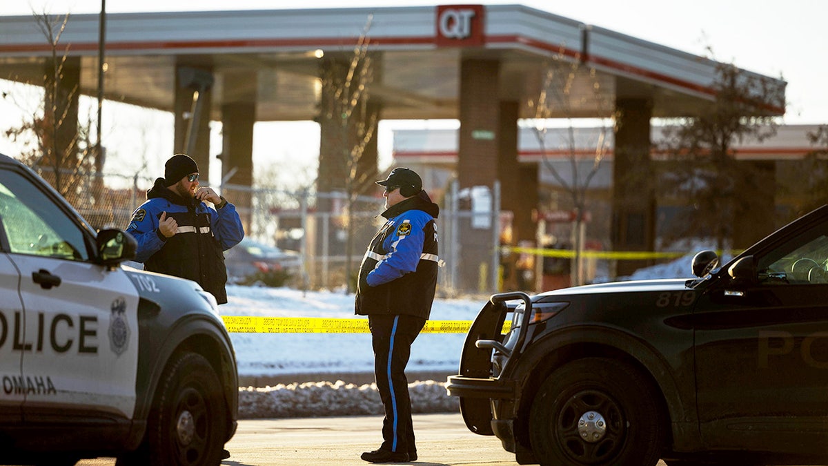 Police and patrol cars outside of gas station where shooting unfolded in Omaha, Nebraska