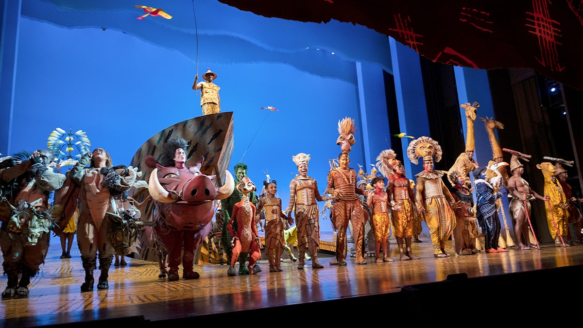Actors from the Broadway production of "The Lion King" one stage