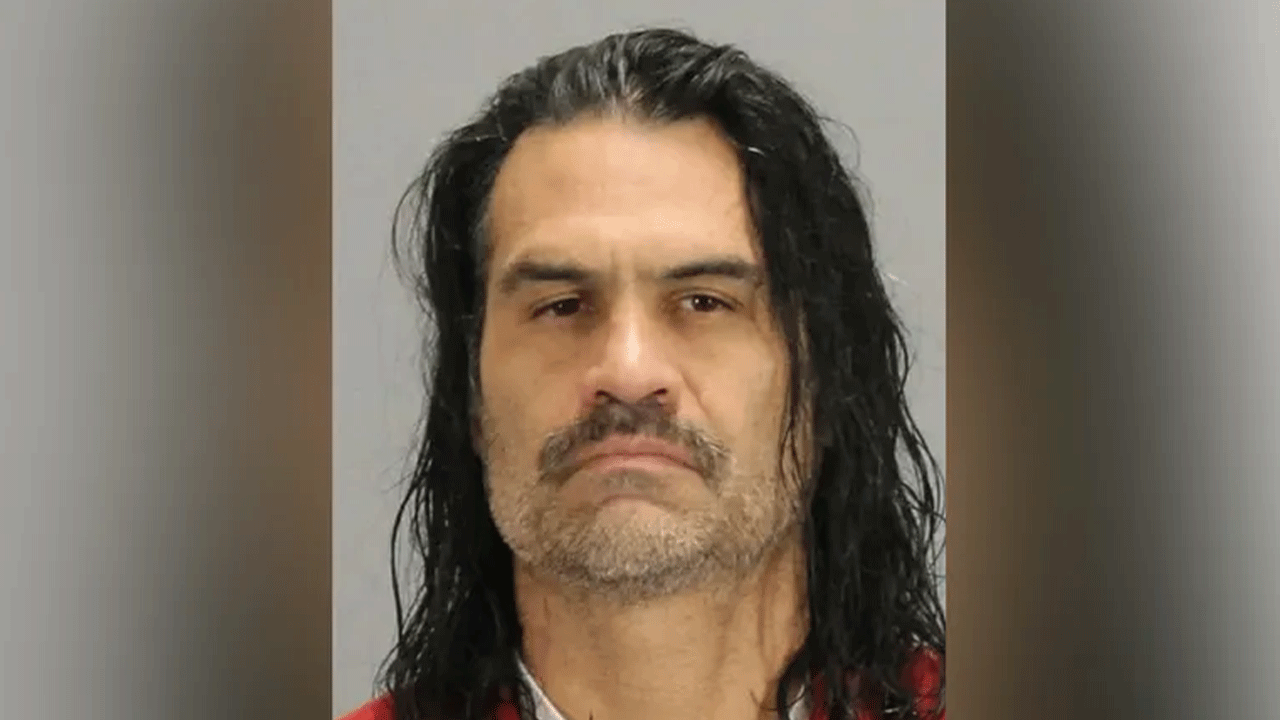 mugshot of man with long hair
