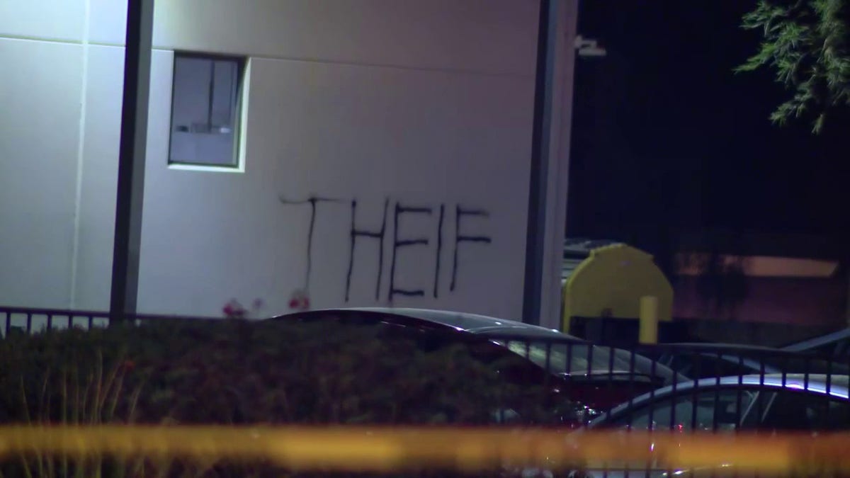 A vandal wrote "Theif" on the side of a Tesla dealership