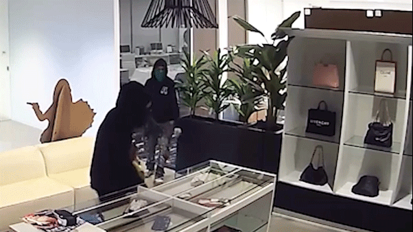 Massive luxury handbag heist caught on camera as heavily armed police swarm California store Massive luxury handbag heist caught on camera as heavily armed police swarm California store