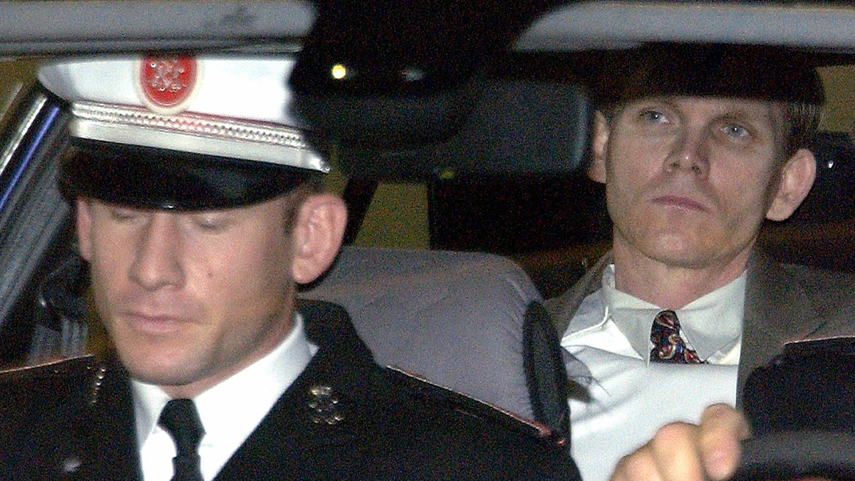 Ted Maher is transported by authorities following a court appearance