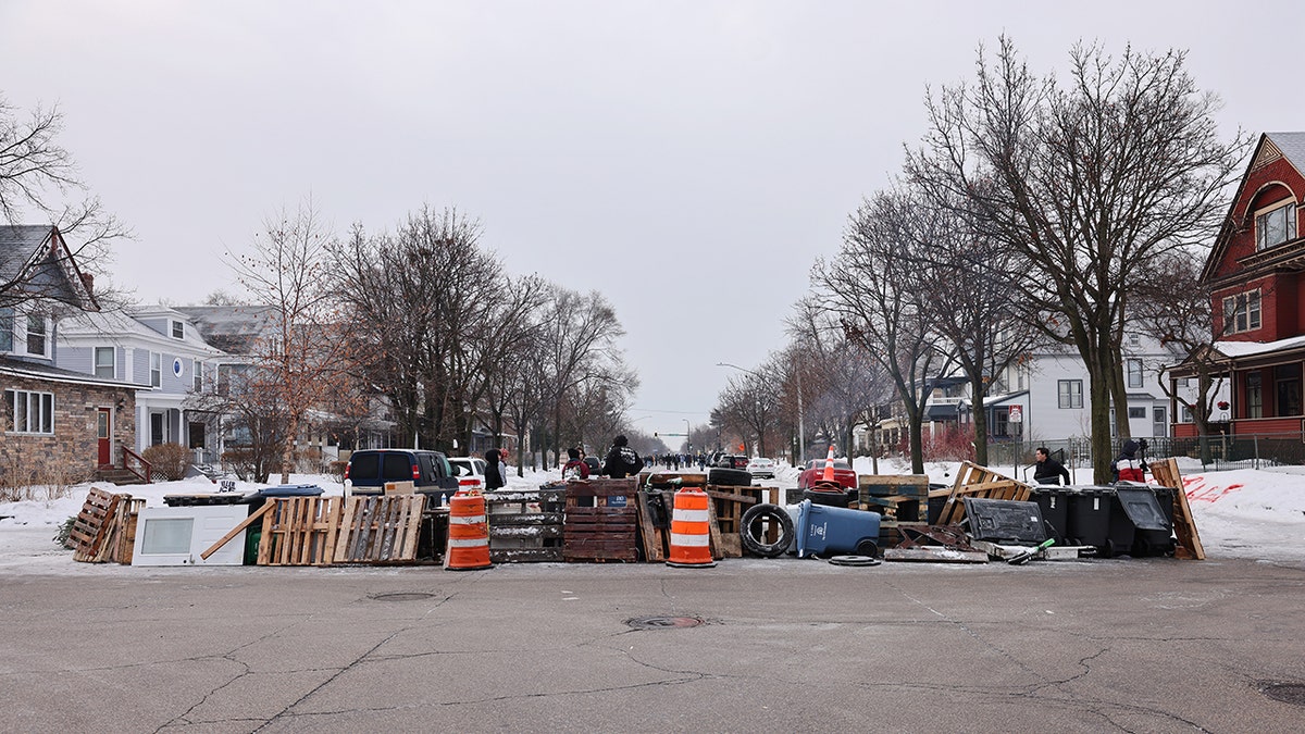 Location of ICE shooting barricaded by residents in Minneapolis