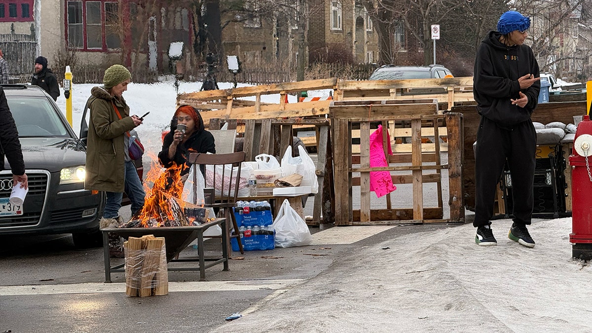 Location of ICE shooting barricaded by residents in Minneapolis