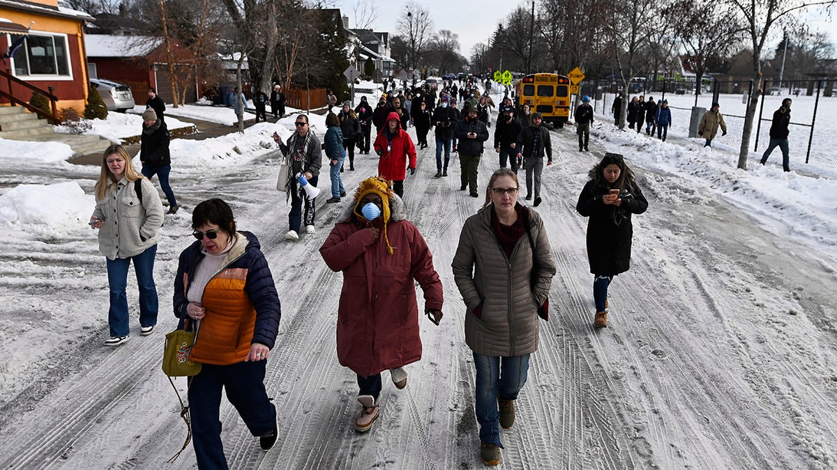 People gather near the scene of the shooting