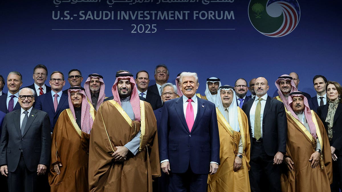 U.S. President Donald Trump poses for a family picture with Saudi Crown Prince and Prime Minister Mohammed bin Salman and other attendees during the U.S.-Saudi Investment Forum in Washington