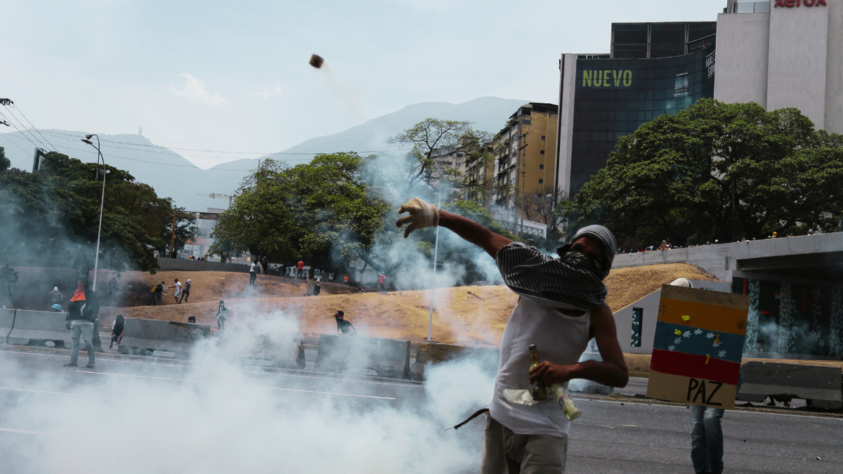 Demonstrators critical of the Venezuelan government clash with the security forces of the state.