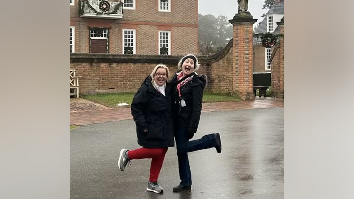 Zoe Welsh (L) and friend Angie (R) pose for a photo